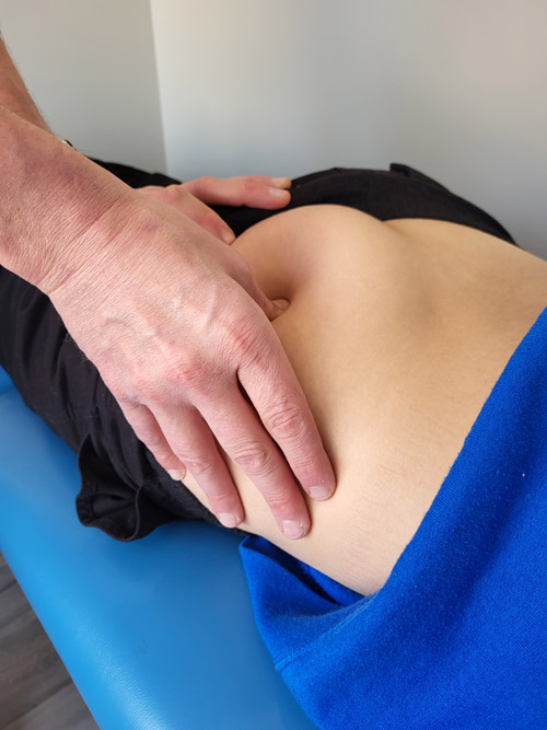 Dr. Steve giving patient ART and Trigger Point Therapy for sciatica pain relief