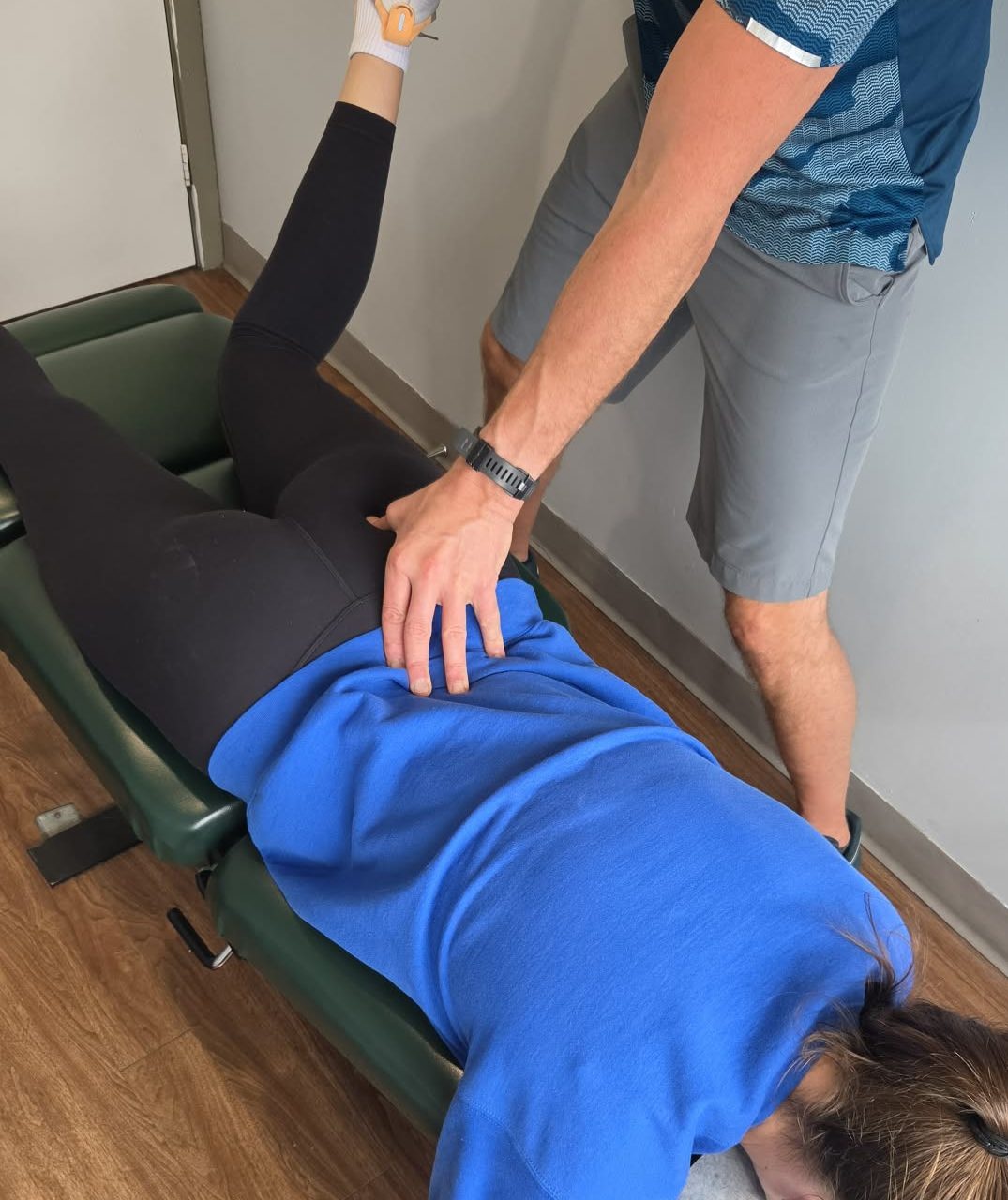 Dr. Steve assessing a patients low back