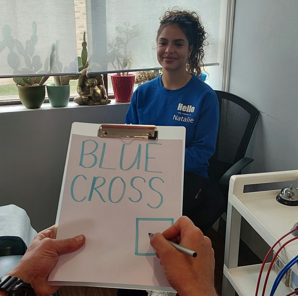 Dr. Steve checking off a Blue cross insurance box for a veterans affairs patient to get direct insurance billing