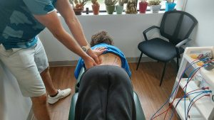 Dr. Steve driving his thumbs into trigger points along the TL junction musles