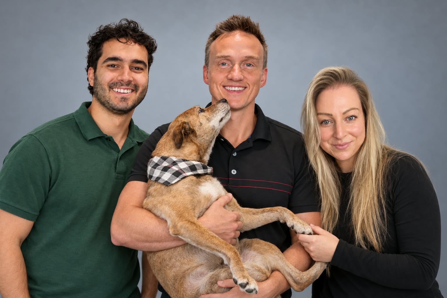 Our Oakville chiropractic team: Dr. Alex, Dr. Steve and Dr. Jenn. Dr. Steve Knighton is in the middle holding one of our clinic dogs Trudy!