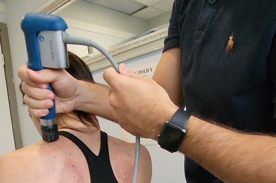 shockwave therapy on a patients left neck with vertigo
